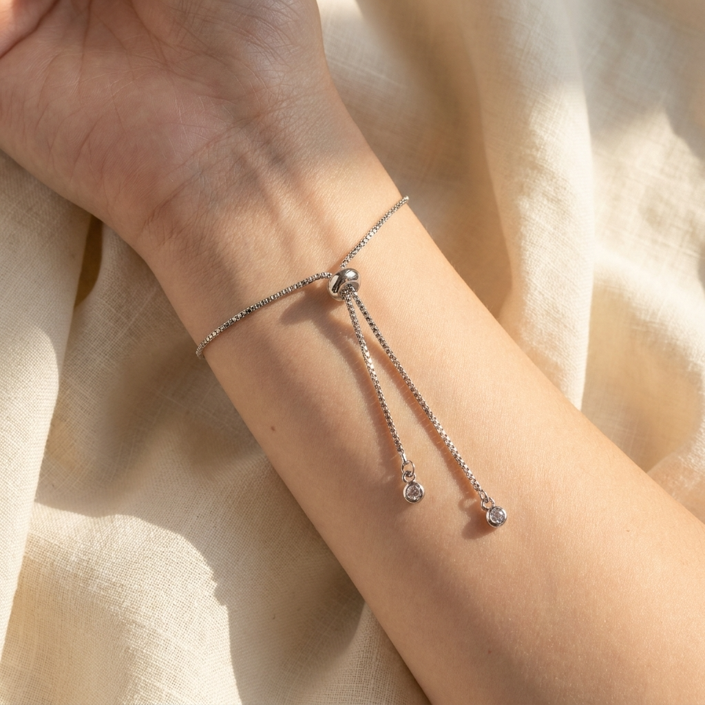 Close-up of the adjustable slider mechanism on a platinum plated blue lobelia bracelet, showing the bracelet fastening and fit detail