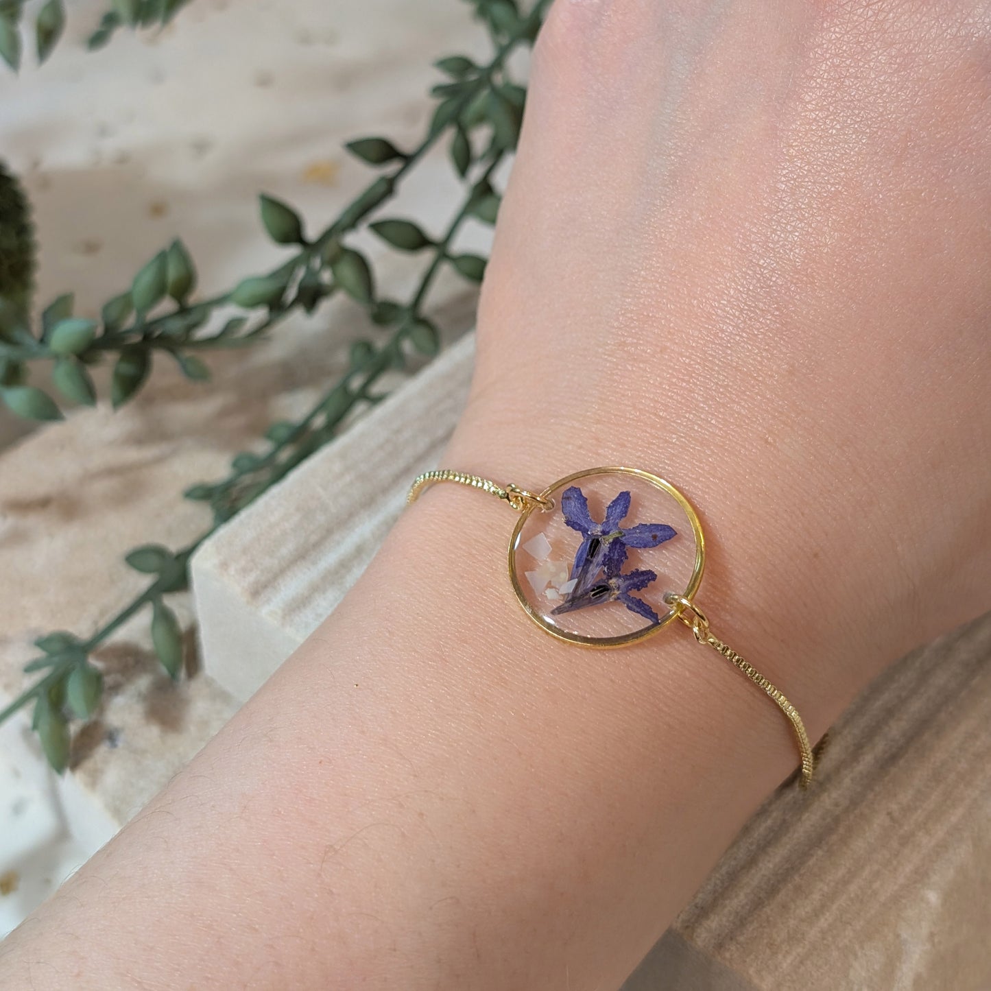 Lobelias on seashell flakes Adjustable Bracelet on model hand