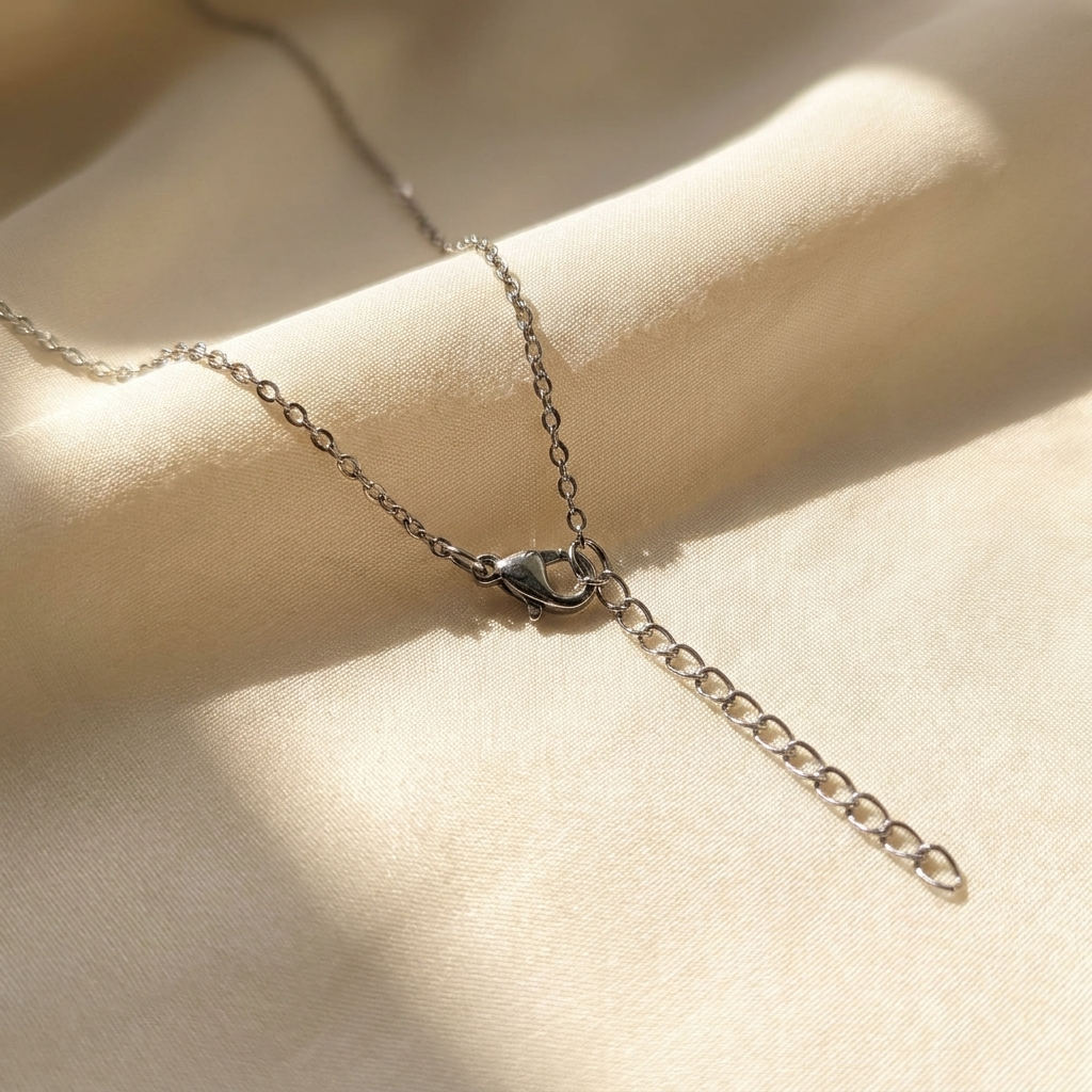Close-up of the 5cm extension chain on a Stainless Steel pink chive blossom necklace, showing the necklace fastening and adjustable length detail